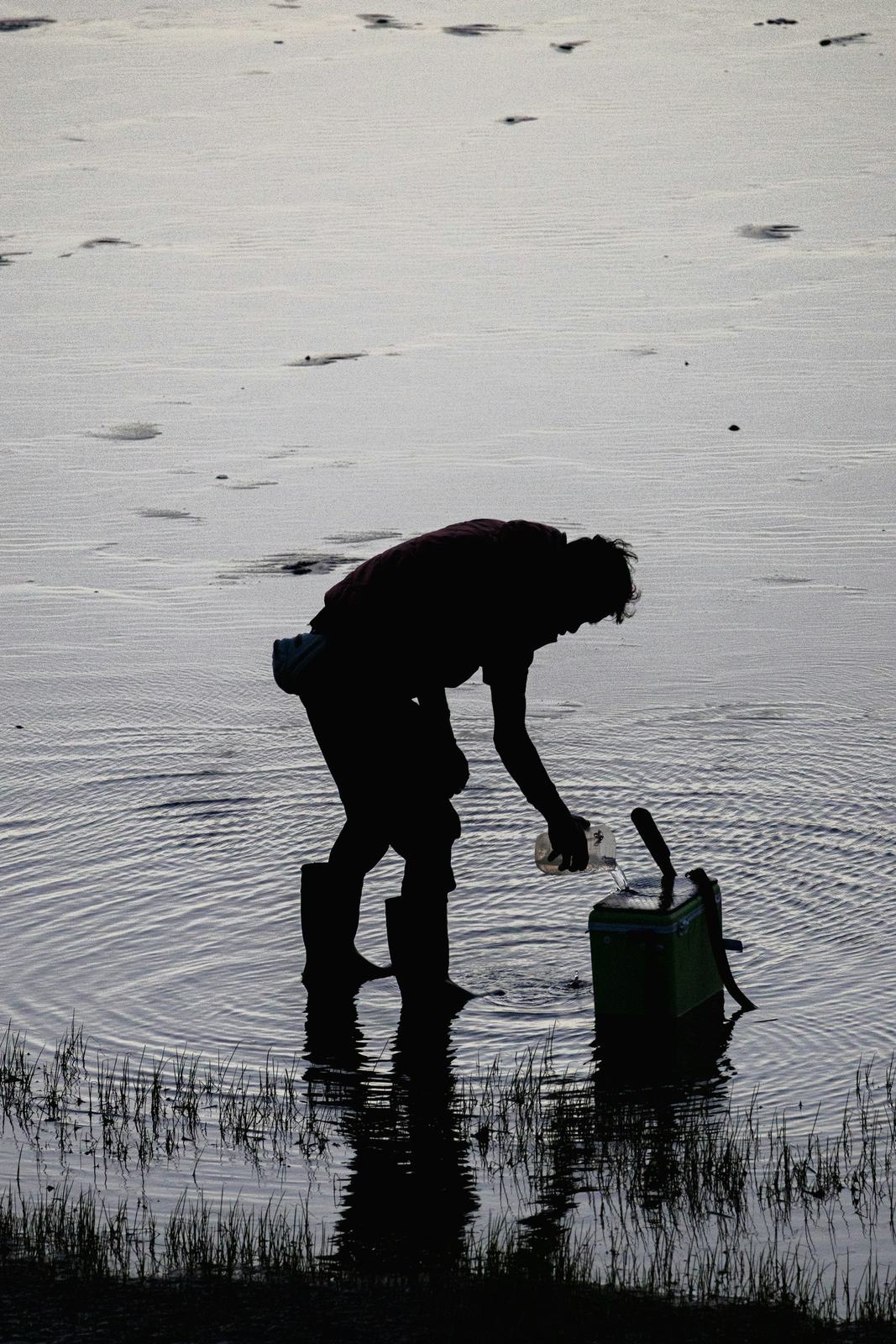 Technician taking a water sample